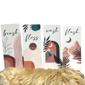 Boho Bathroom Decor stating  wash, flush, brush and  floss‎ signs